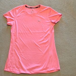 Nike women’s running dri-fit short sleeve shirt in peachy pink. Size small